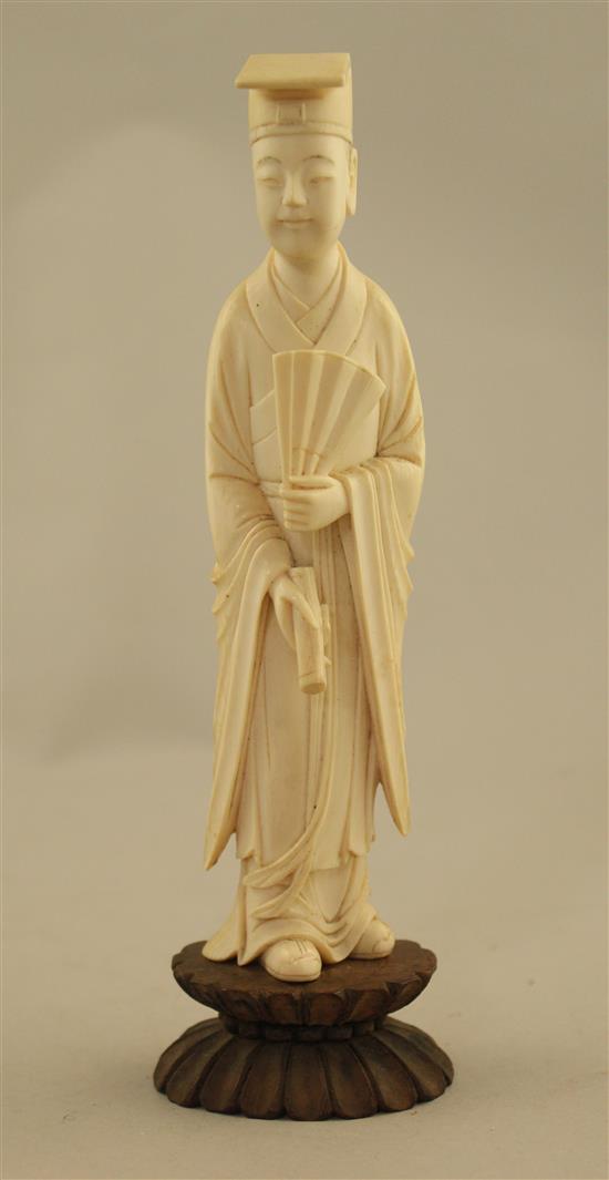 A Chinese ivory figure of a scholar, early 20th century, 17.5cm incl. stand, fitted box